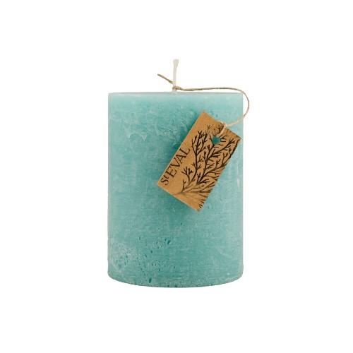 A single teal-colored pillar candle with a textured finish, featuring a small brown paper tag with a tree design and the brand name 'SEVAL' tied to the top wick, set against a plain white background.