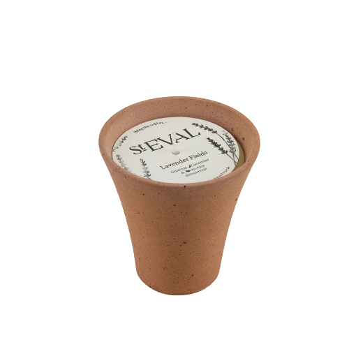 A small terracotta-colored ceramic pot candle by S&EVAL, featuring a white circular label with 'S&EVAL Lavendel Pflüste' and botanical illustrations, set against a plain white background.