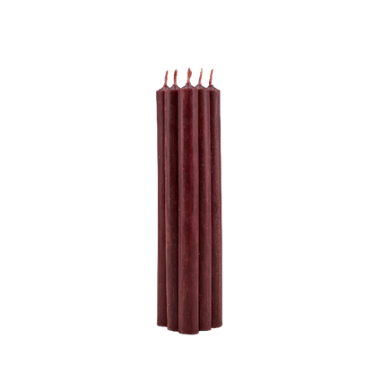 A set of five tall, dark red wax taper candles standing upright in a tight cluster on a plain white background.